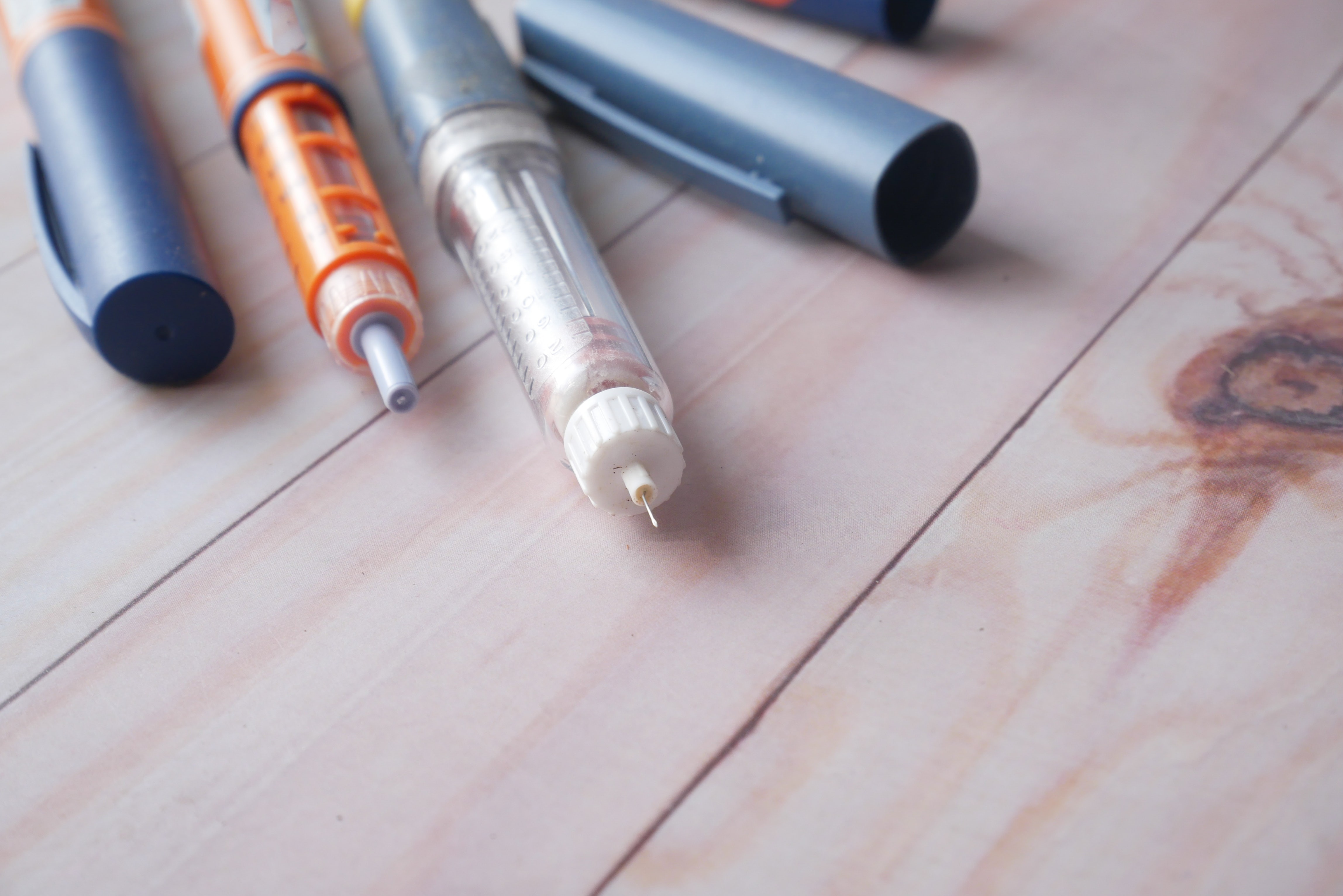 image of pens and medical equipment related to diabetes